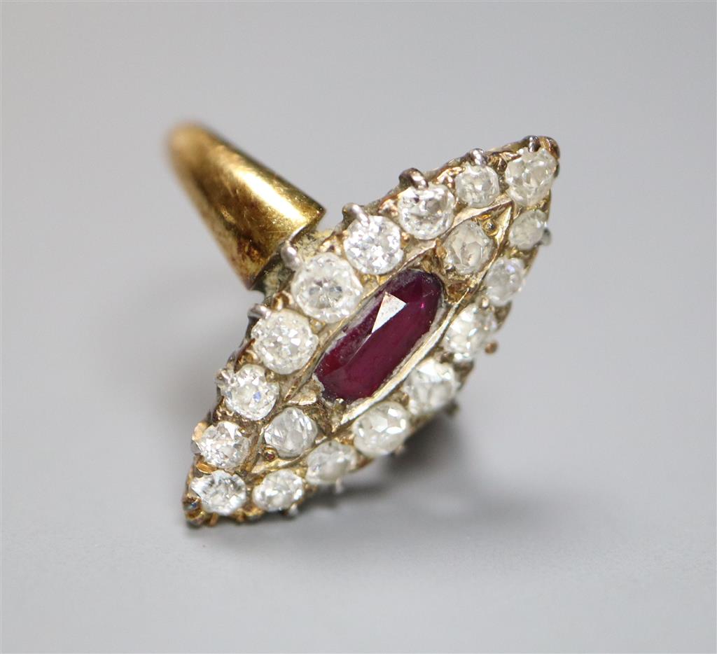 A yellow metal, ruby and diamond cluster set marquise shaped dress ring, shank has been cut and misshapen, gross 4.1 grams.